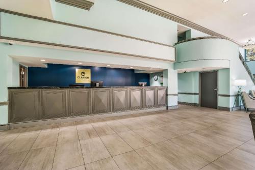 a large lobby with a waiting area and a waiting room at MainStay Suites Florence - Darlington in Florence