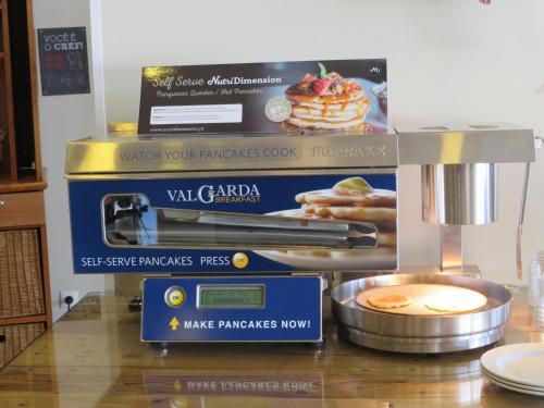 a stand with a mixer and a box of pancakes at Hotel ibis Faro Algarve in Faro