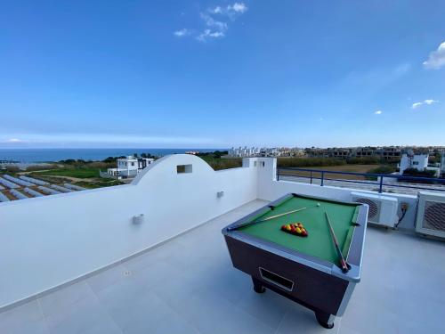 a pool table on the roof of a house at Villa Kapparis Sunrise in Paralimni