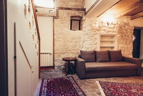 a living room with a couch and a table at Hotel Casa Garzotto in Rovinj