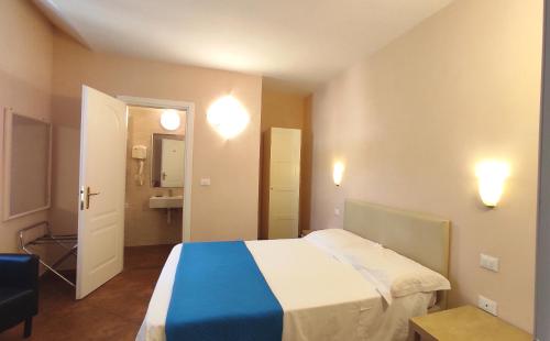 Postel nebo postele na pokoji v ubytování Hotel Rita Major