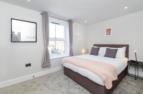 a bedroom with a large bed and a window at The Old Hotel in York
