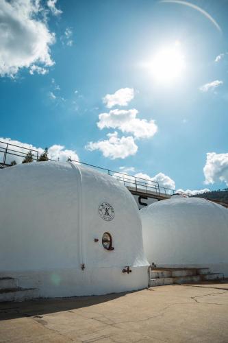 two white domes sitting next to each other at Quinta São Luiz The Vine House Douro in Tabuaço