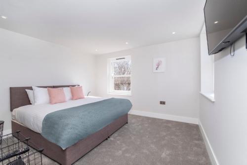 a bedroom with a bed and a window at The Old Hotel in York