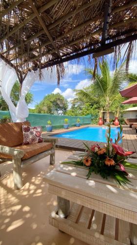 a resort with a pool and a couch and a table at Charming House in Albion with Shared Pool in Albion
