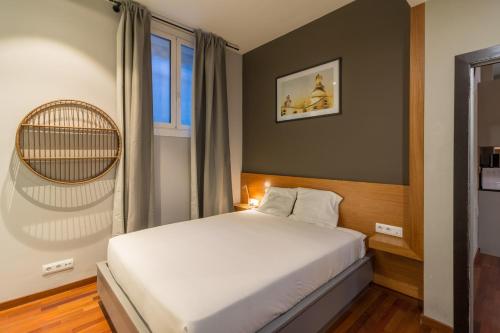 เตียงในห้องที่ Key Paseo de Gracia Gaudí y Miró