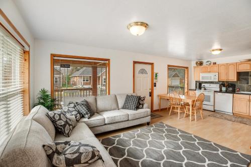 a living room with a couch and a table at Samuel's Haven in Rockaway Beach
