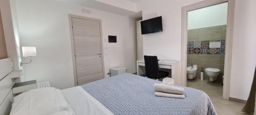 Ένα ή περισσότερα κρεβάτια σε δωμάτιο στο Belvedere Rent Rooms