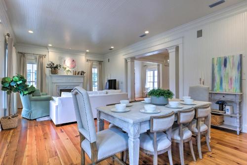a dining room with a table and chairs at Luxe Fairhope Home with Covered Patio Walk to Bay in Fairhope