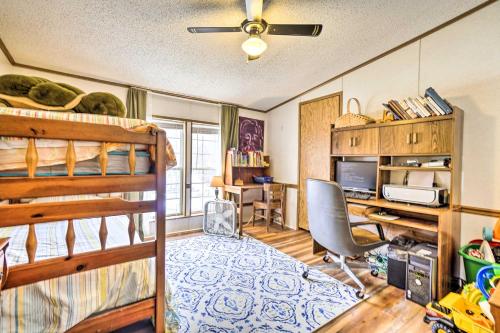 a dorm room with a bunk bed and a desk at Rustic Family Home and Acreage about 20 Mi Hocking Hills in Lancaster