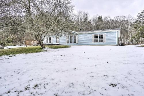 a house with a yard covered in snow at Rustic Family Home and Acreage about 20 Mi Hocking Hills in Lancaster