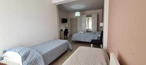 Ένα ή περισσότερα κρεβάτια σε δωμάτιο στο Belvedere Rent Rooms