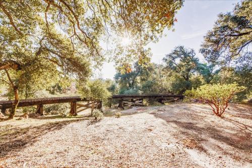 a picnic table in the middle of a field with trees at Hot tub Disney train track in Julian amazing views in Julian