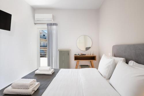 Posteľ alebo postele v izbe v ubytovaní West City Apartment