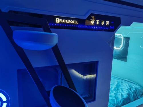 an atm machine with a blue light on it at Futurotel Malagueta Beach in Málaga