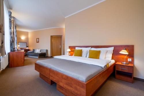 Postel nebo postele na pokoji v ubytování Hotel U Vlašského Dvora