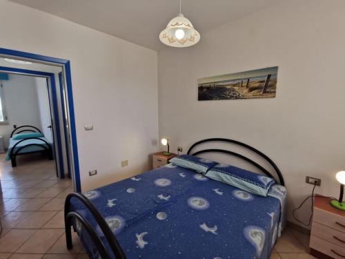 A bed or beds in a room at Appartamento Ghirigoro 2