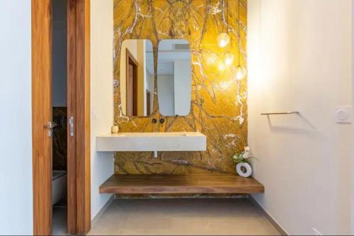 a bathroom with a sink and a mirror at Villa Green Paradise in Marrakesh