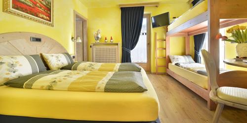 Ένα ή περισσότερα κρεβάτια σε δωμάτιο στο Hotel Piccolo Mondo