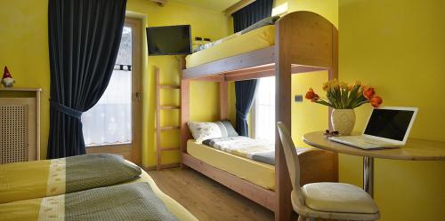 Ένα ή περισσότερα κρεβάτια σε δωμάτιο στο Hotel Piccolo Mondo