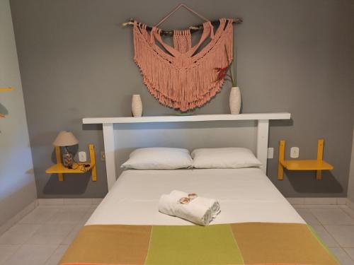 Säng eller sängar i ett rum på Pousada Brisa do Mar