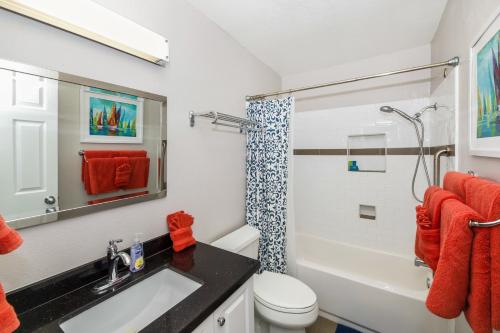 a bathroom with a sink and a toilet and a shower at B301 - Seaclusion - On-the-Sand in Oceanside