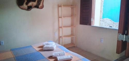 En eller flere senge i et værelse på Casa de veraneio