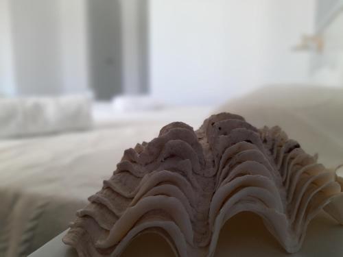 a cake sitting on top of a white plate at Elia in Skala