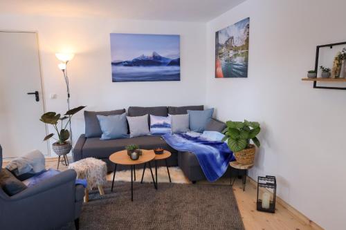 a living room with a couch and a table at Ferienwohnung Mariedei in Berchtesgaden