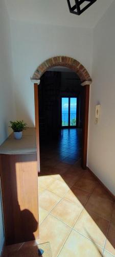 a hallway with an archway in a house at Casa Pasitea in Taormina
