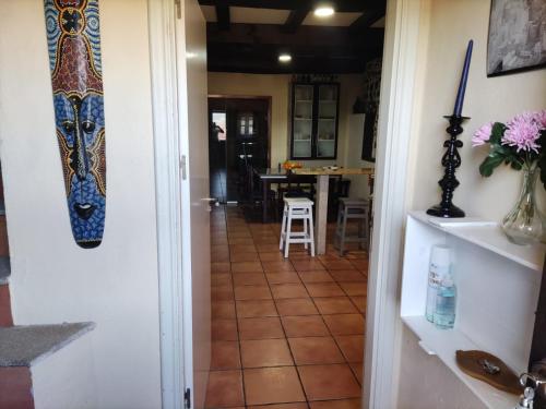 a hallway leading into a kitchen with a tile floor at Falagueira in Monforte de Lemos