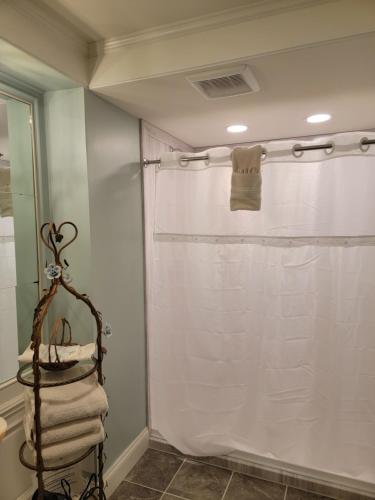 a towel rack in a bathroom with a shower at Lowell Inn in Stillwater