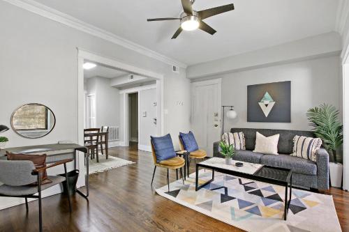 a living room with a couch and a table at Comfy and Chic 2BR Apt close to Shops - Sunnyside 2F in Chicago