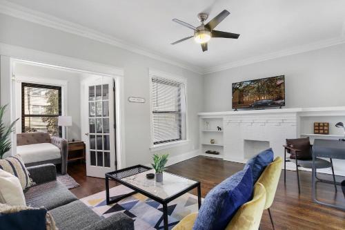 a living room with a couch and a fireplace at Comfy and Chic 2BR Apt close to Shops - Sunnyside 2F in Chicago