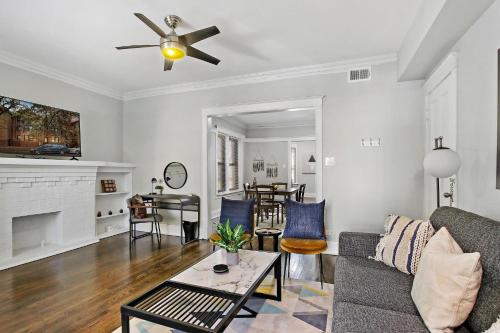 a living room with a couch and a table at Comfy and Chic 2BR Apt close to Shops - Sunnyside 2F in Chicago