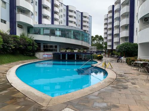 a large swimming pool in front of a building at Aguas da Serra 322 A in Rio Quente