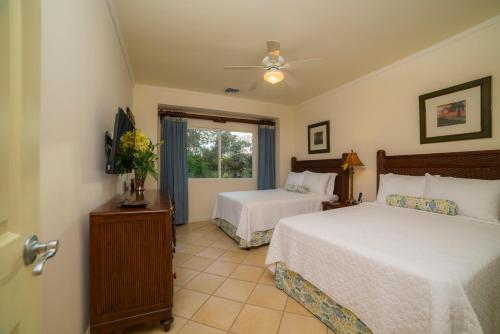 a bedroom with two beds and a window at Los Suenos Resort Del Mar 5F golf views by Stay in CR in Herradura