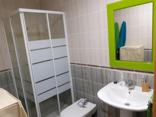 a bathroom with a sink and a mirror at Pau-pi in Oliva