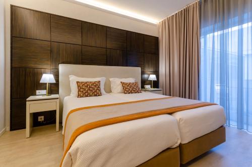 Una cama o camas en una habitación de Hotel Lido