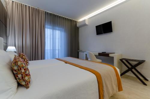 Una cama o camas en una habitación de Hotel Lido