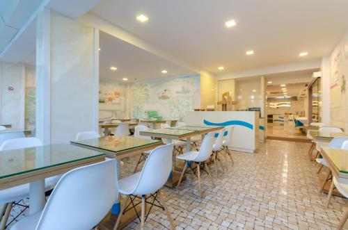 Un restaurante u otro lugar para comer en Hotel Lido