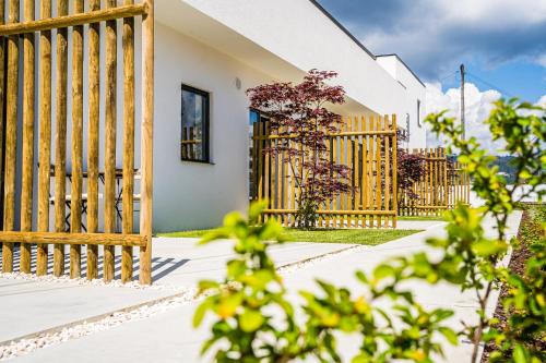 a wooden fence in front of a house at Casas da Padaria in Celorico de Basto