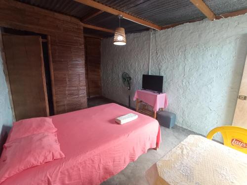 Säng eller sängar i ett rum på Casa Canaima beach