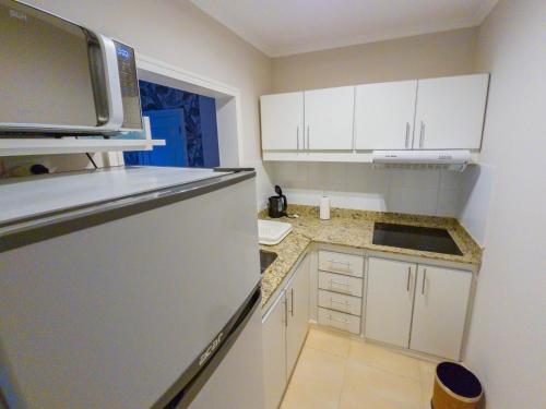 Kuchyň nebo kuchyňský kout v ubytování Garden Suites Pinamar