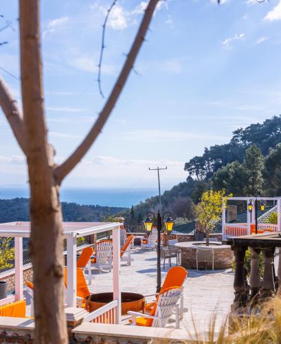 a playground with orange chairs and a train at Çetmihan Hotel in Kucukkuyu