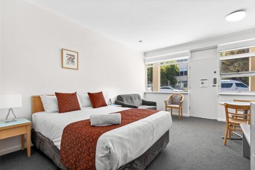 Ένα ή περισσότερα κρεβάτια σε δωμάτιο στο Taft Apartments