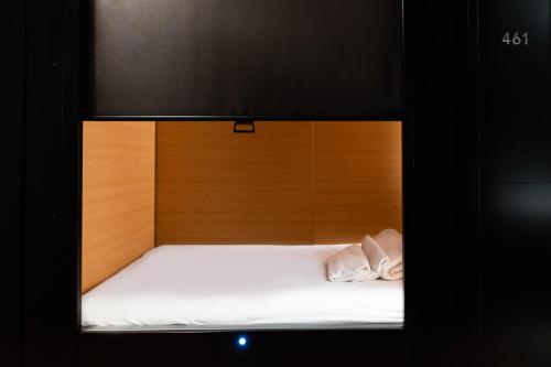 a bed in a room with a bed frame at Nap York Central Park Sleep Station in New York