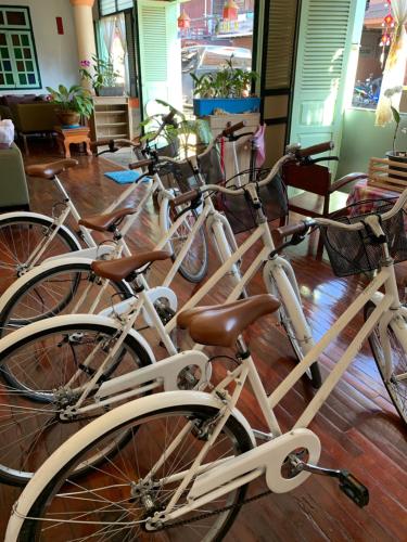 a group of bikes parked in a room at The White House in Chiang Khan