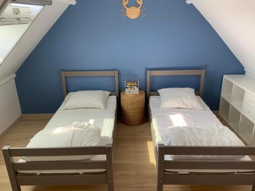 Ένα ή περισσότερα κρεβάτια σε δωμάτιο στο Maison de Lervilly - Face à l'Océan