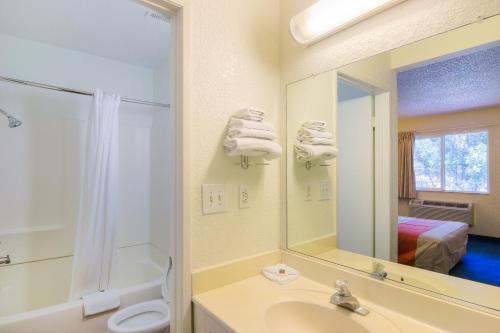 
a bathroom with a shower, sink, and toilet at Motel 6-Sepulveda, CA - Los Angeles - Van Nuys - North Hills in North Hills
